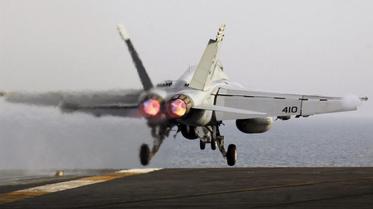 US fighter jet rolls off aircraft carrier, sinks into ocean, Navy says