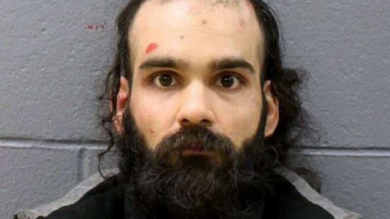 Man sentenced to time served for trying to open plane door, stab attendant in neck